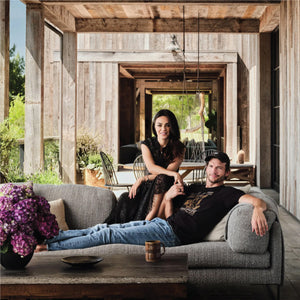  Ashton Kutcher and Mila Kunis on a sofa in their newly renovated home 
