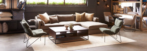 Shot of the interior of the Cisco Home store in Pasadena. Large sofa with two iron chairs left and right of the sofa with a large metal coffee table in the center