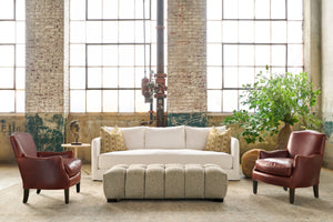  White sofa with 2 leather chairs and a tufted ottoman. Photographed in Solvang Chianti. 