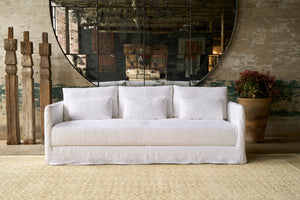  Sofa in front of a large mirror. Photographed in Otis White. 