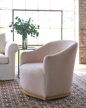  Pink Chair in a showroom on a brown rug. Photographed in Brevard Rose. 