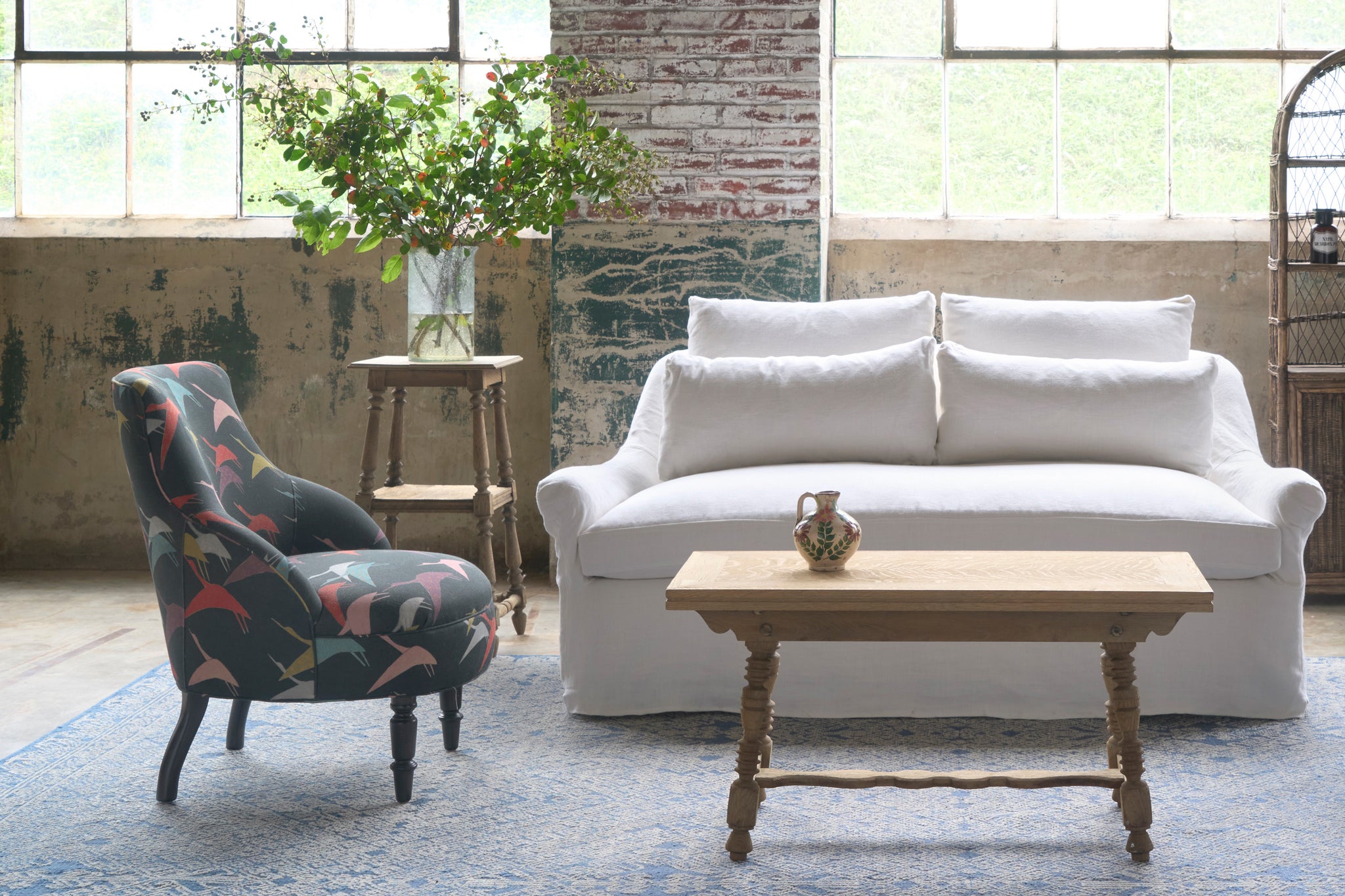  Chair next to a white sofa. Photographed in Brevard Ivory. 