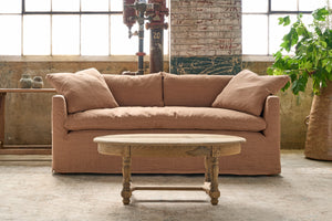  Sofa in brown with an oval wood table in front. Photographed in JD Rye Spice. 