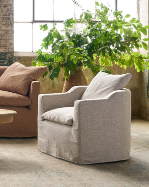  Chair next to a brown sofa. Photographed in Chevron Latte. 