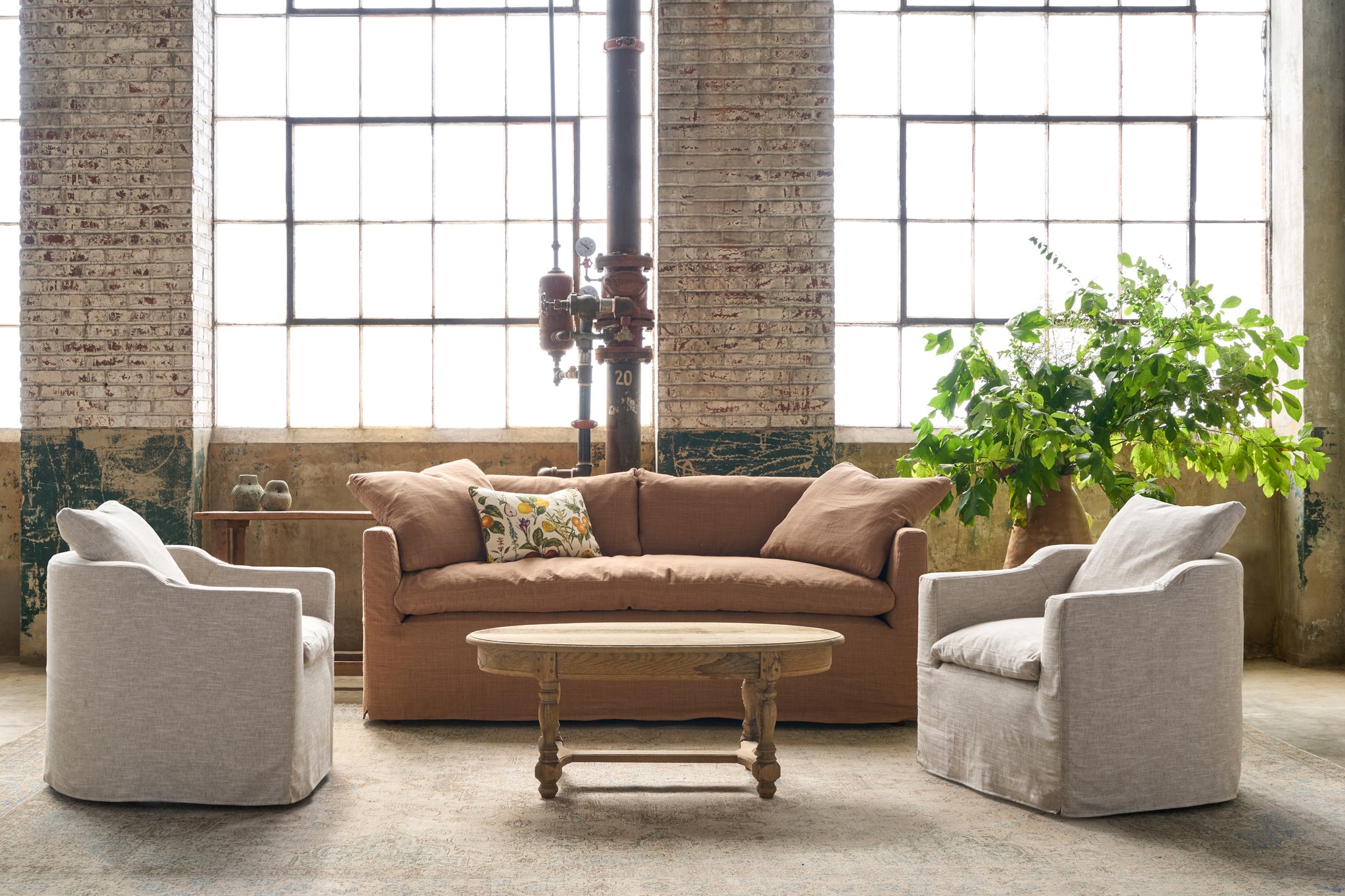  Brown sofa with 2 chairs and an oval wood coffee table. Photographed in Chevron Latte. 