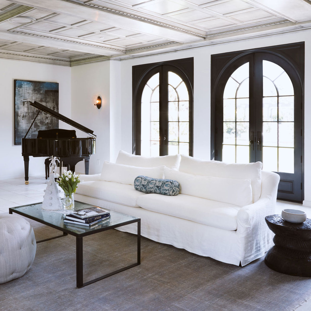  living room with white sofa lounge chair and grand piano 