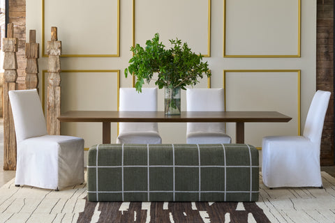 Dining table with 4 with chairs and a green bench. Photographed in Emmet Pine.