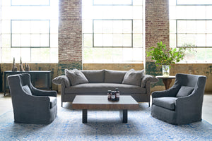  Sofa in dark grey linen with a2 wing chairs on the sides and a wood coffee table. Photographed in Rye Warm Grey 