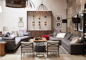 interior shot of Cisco Home store with two sofas two chairs and light wall feature 