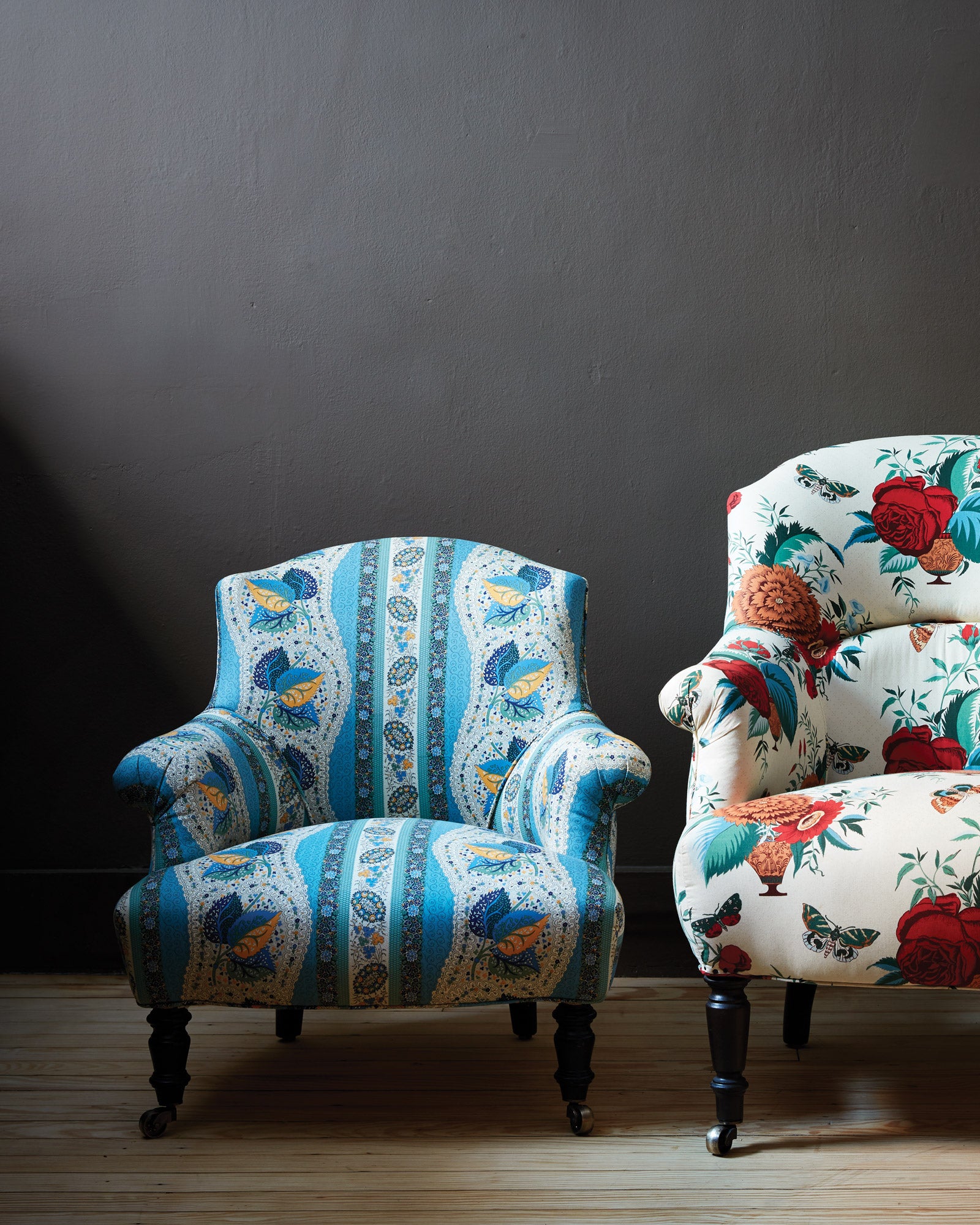  Two chairs in printed John Derian Fabric with a dark wall in the background. Photographed in John Derian Fabric. 