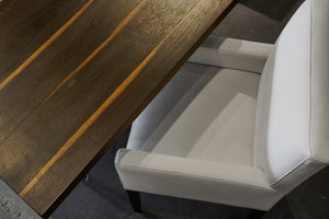  Top view of a chair in Molino White next to a wood table. Photographed in Molino White. 
