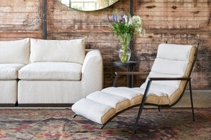  Vanocur Natural Declan Chaise in cream fabric with the Lorenzo Sofa in a textured cream fabric and a round side table with flowers. Photographed in Vanocur Natural. 