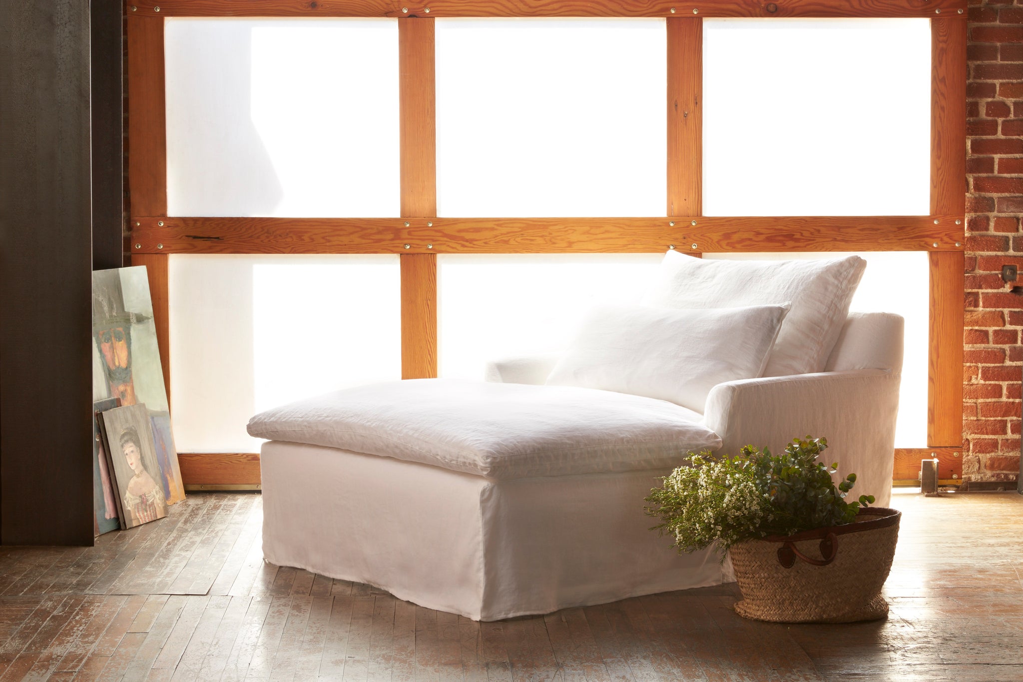  Light filled interior with Donato Double Chaise in Otis White. Photographed in Otis White. 