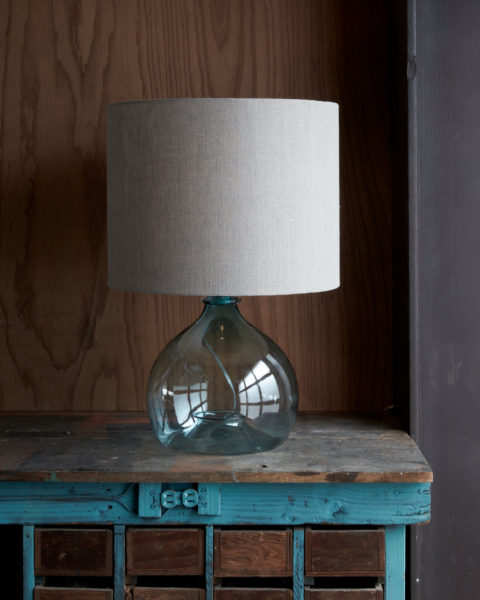  Jug table lamp in turquoise finish with white fabric lamp shade.  