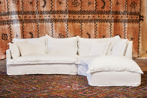  Paloma 3pc Sectional in Otis White. Underneath the sectional is a multi-colored patterned rug. Photographed in Otis White. 