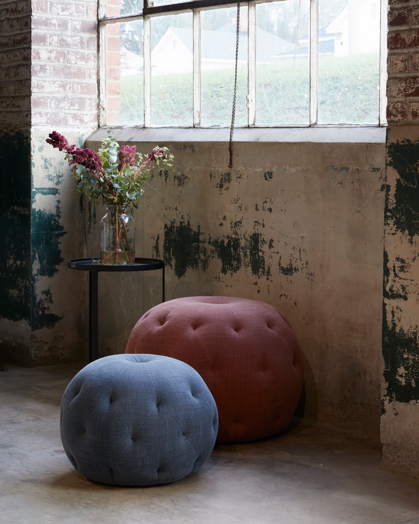  Pouf Ottoman 26 in Rye Terra next to a pouf 20. Photographed in Rye terra. 