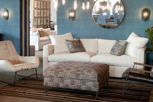  Radley Ottoman in Coco Chocolate (discontinued) next to a light sofa and chair. Photographed in Coco Chocolate. 