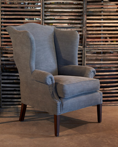 Thorn Tail chair in Molino Slate. In the background is a wood wall. Photographed in Molino Slate.